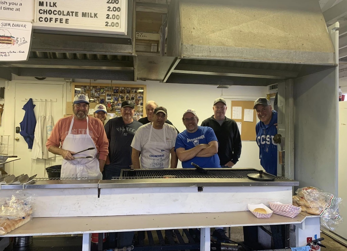 Coginchaug Benchwarmers volunteers working inside the Durham Fair food booth
