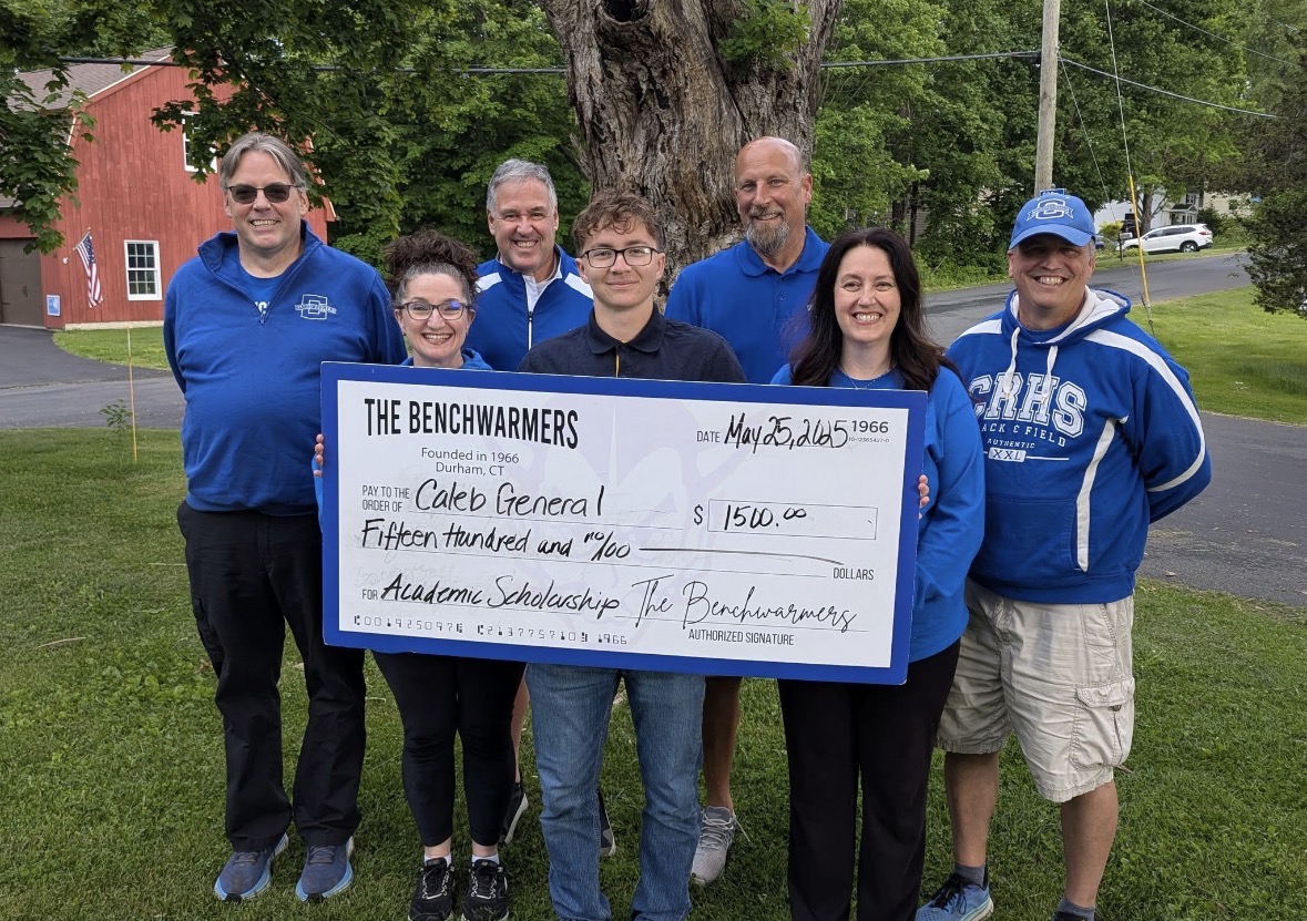 Coginchaug Benchwarmers presenting a scholarship to a student athlete