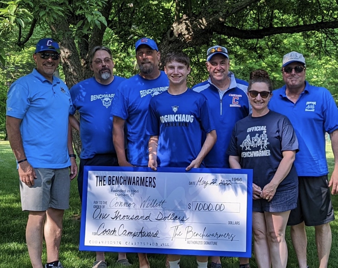 Coginchaug Benchwarmers and a scholarship recipient at an award presentation